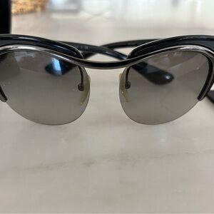 Prada sunglasses few scratches on the lenses does not hamper the site. Marked
